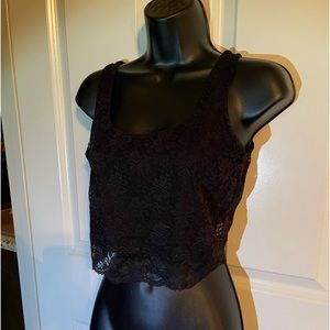 Half shirt. Slip underneath front. Back sheer lace.